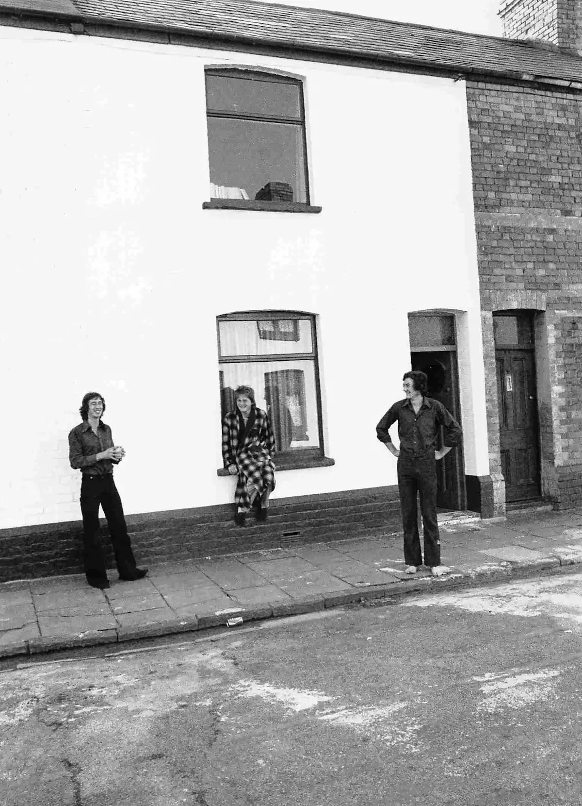 Early John Winter tenants outside their house, 1975